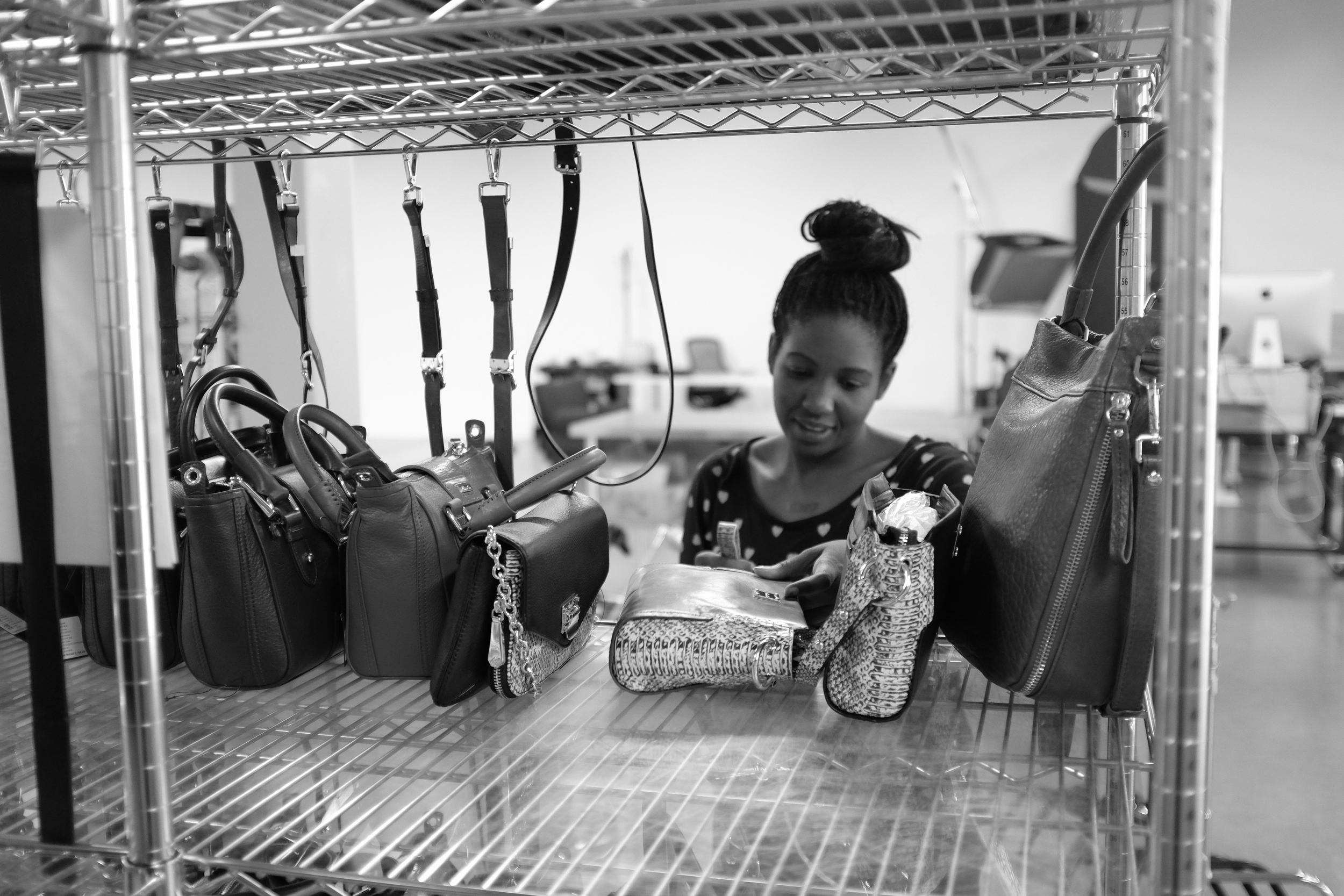 Product Stylist Loretta preps handbags at the HauteLook SB Photo Studio