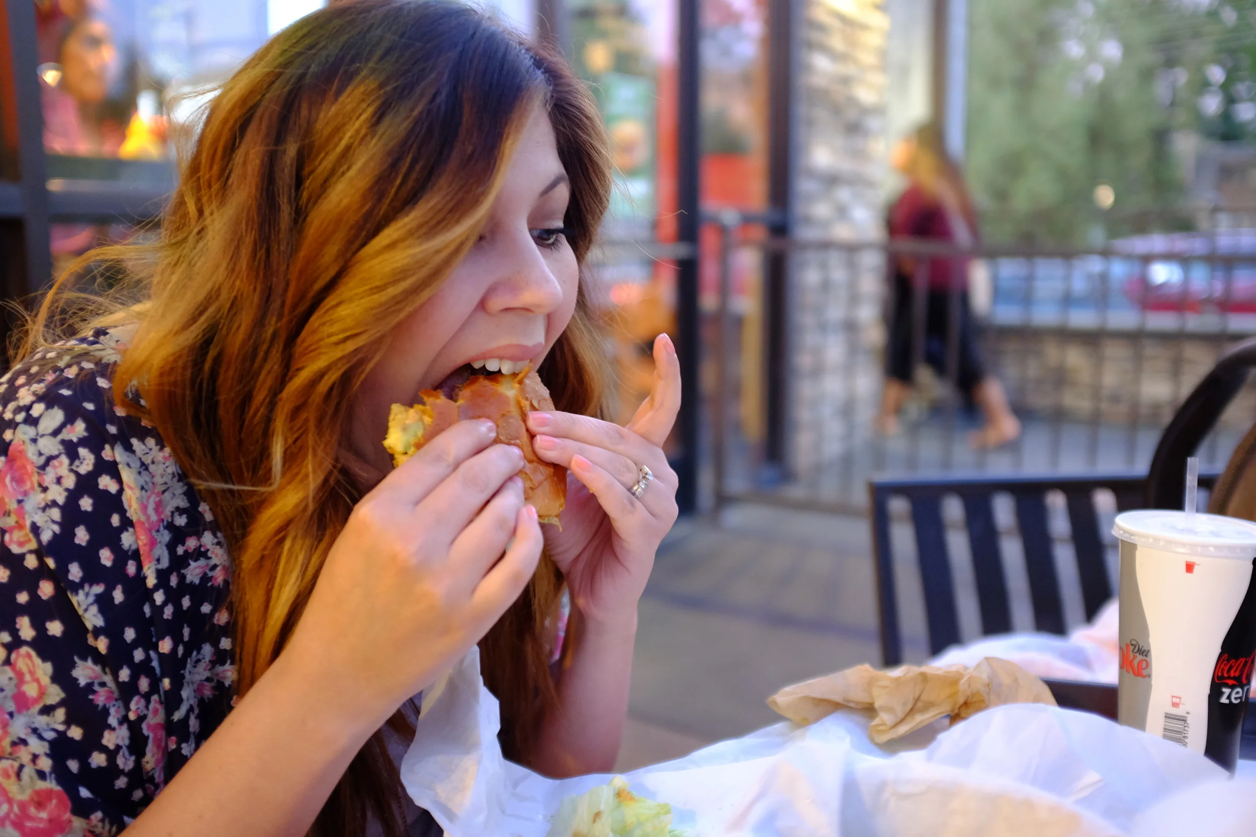 Alesia enjoys her burger from Bucket List Burgers in Canyon Crest