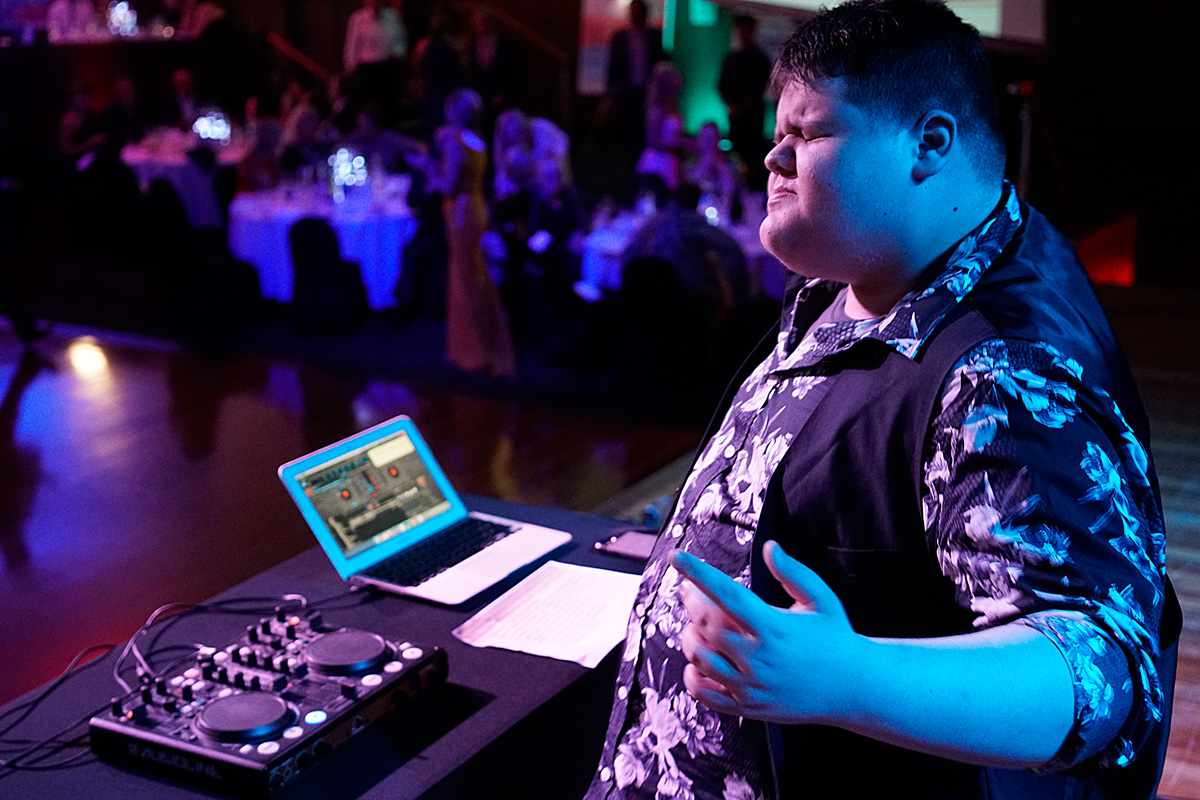 Jackson playing a DJ gig for a school fundraiser. Photo credit: David Drews
