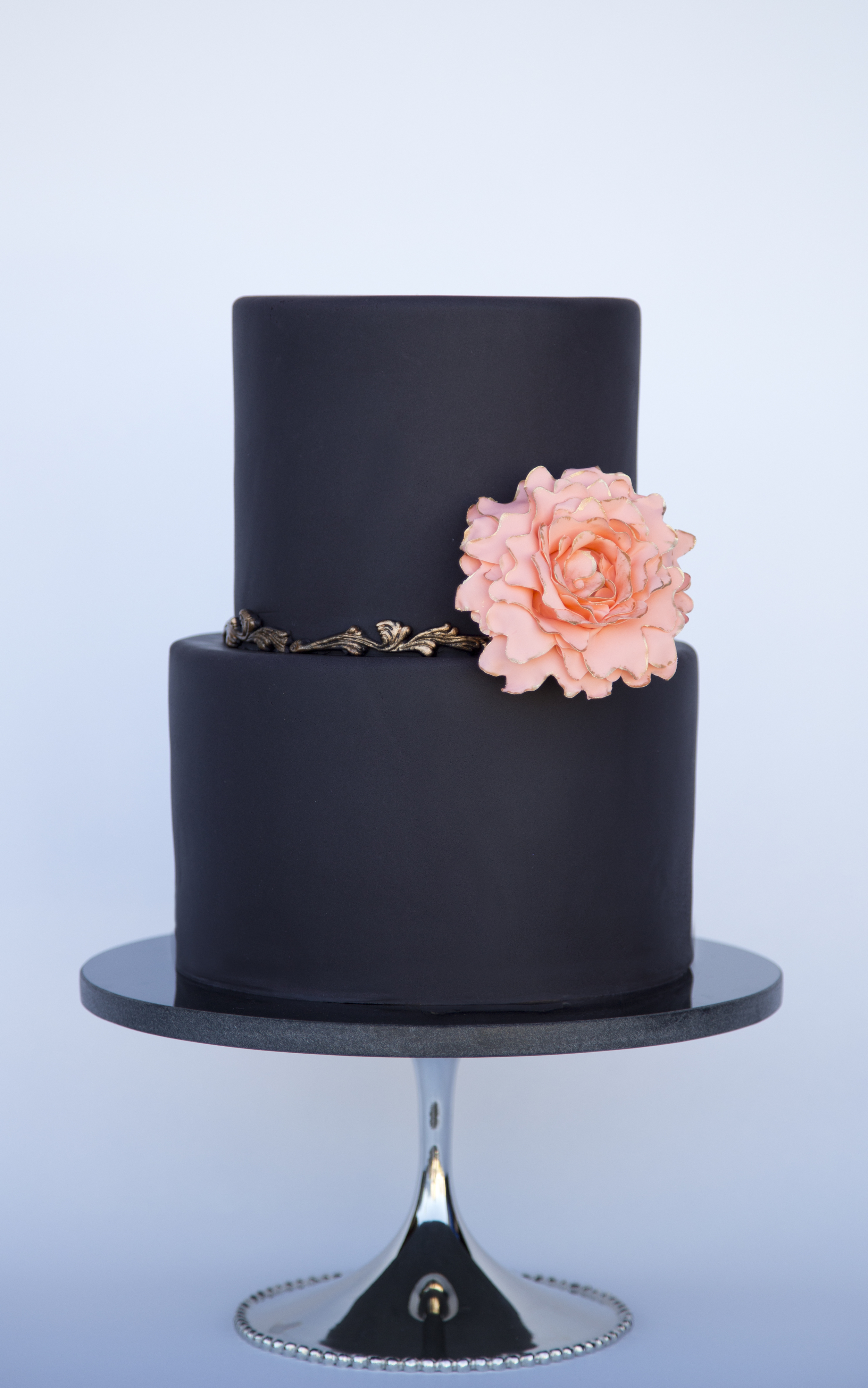black cake with coral sugar peony