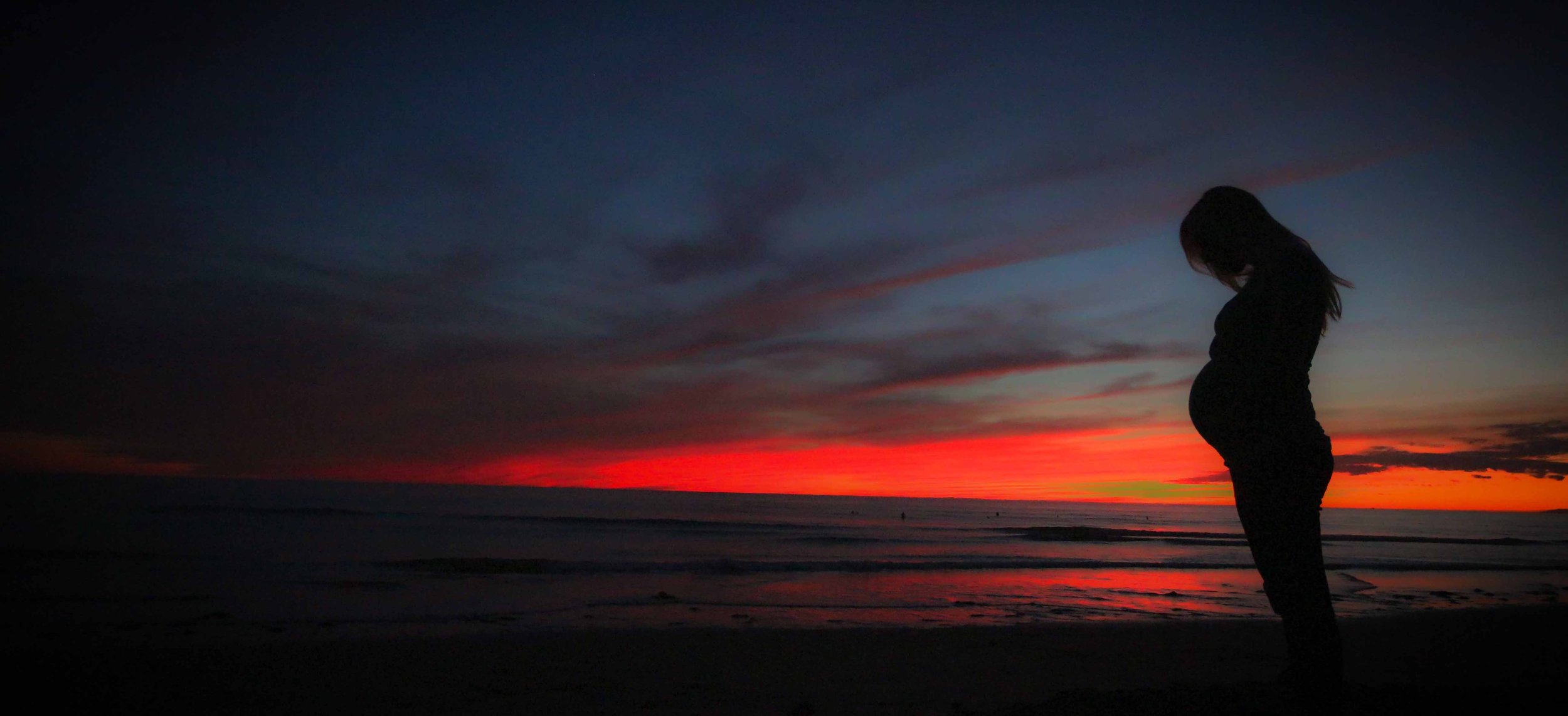 pregnant-beach-sunset-mother-51386.jpg