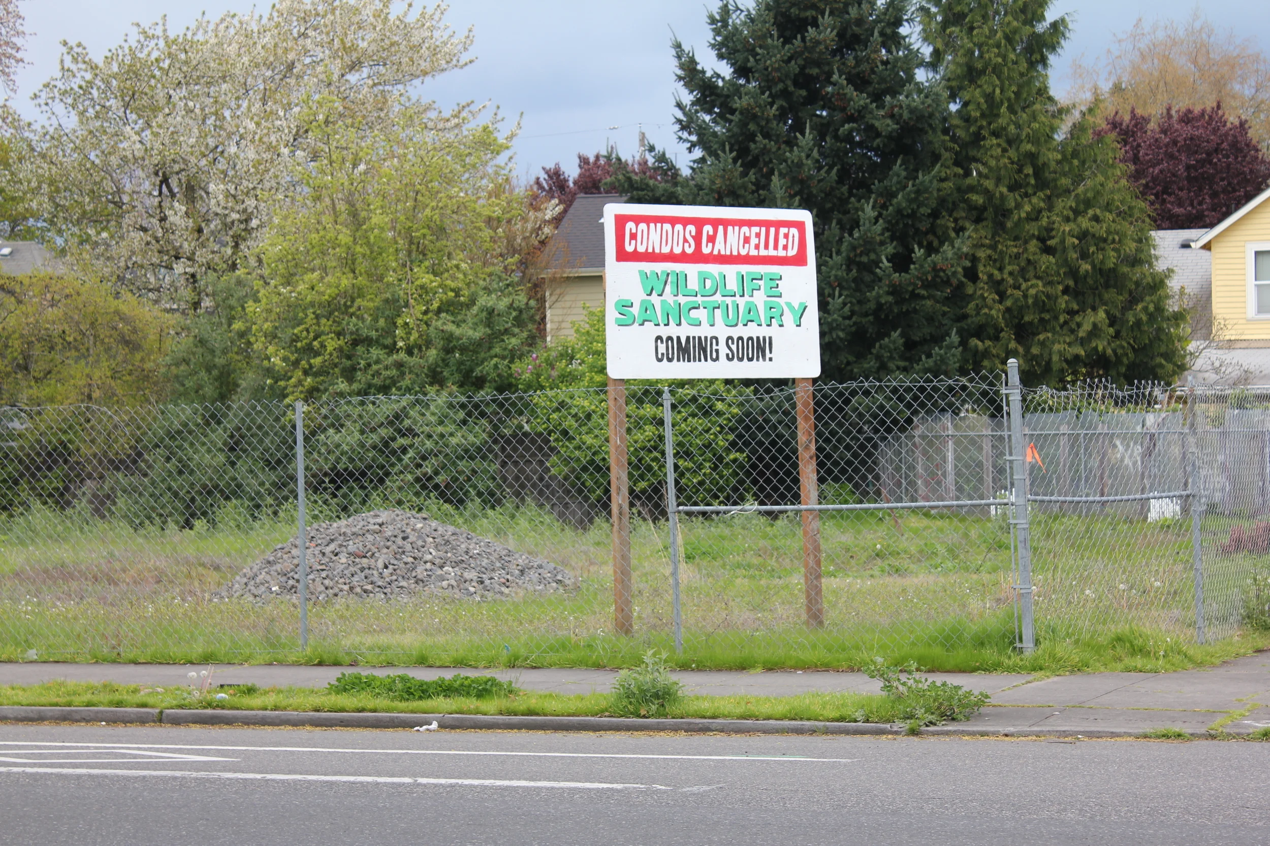  This sign was erected as an intervention in response to the incessant development and increasing gentrification of Northeast Portland, where condos are springing up on every corner. &nbsp;Empty lots like this one provide rare spacial reprieve in the