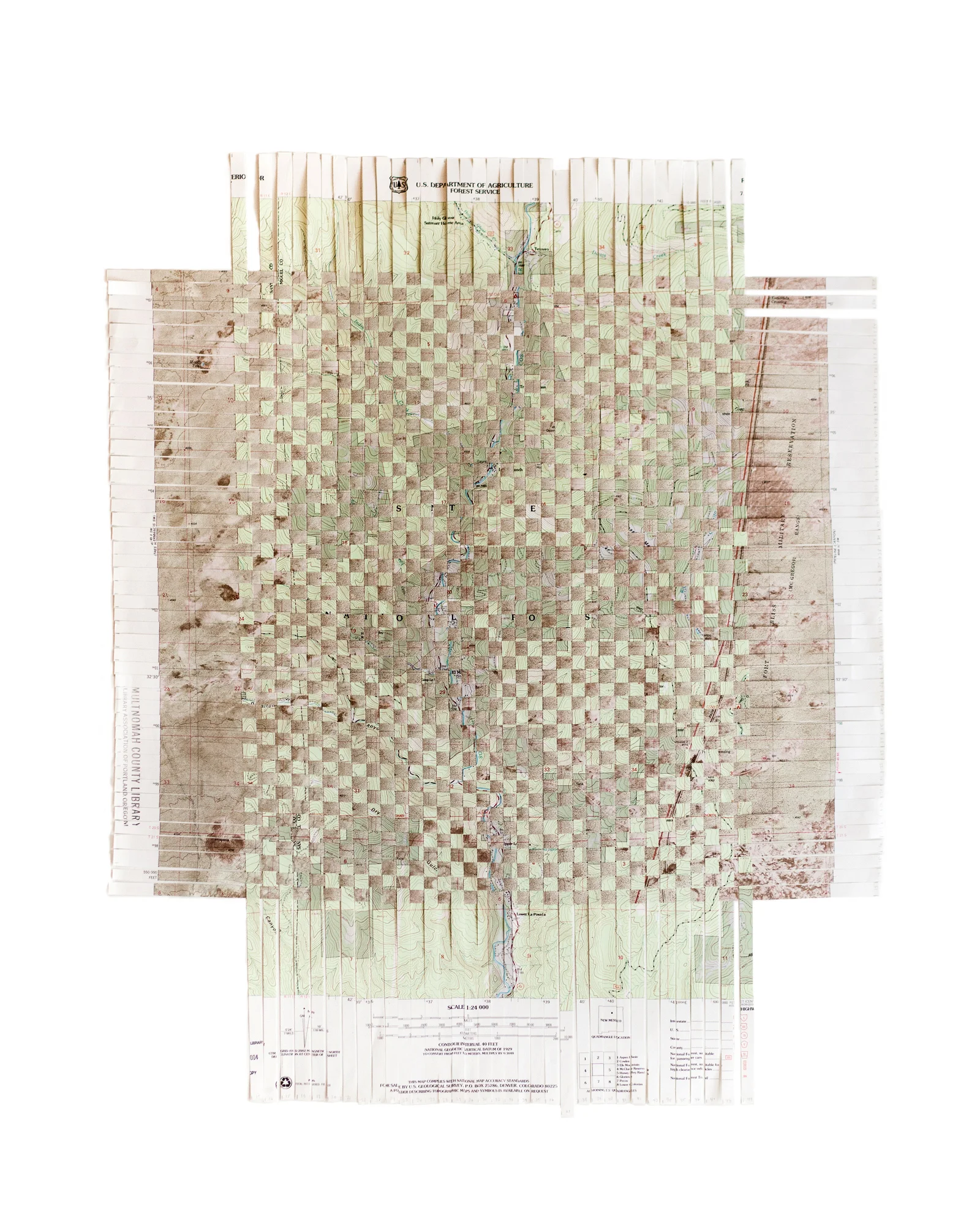 Land Weaving II , 2015, 22" x 27" Combines a USGS map of the Santa Fe National Forest with a USGS map of Fort Bliss Military Reservation, New Mexico.