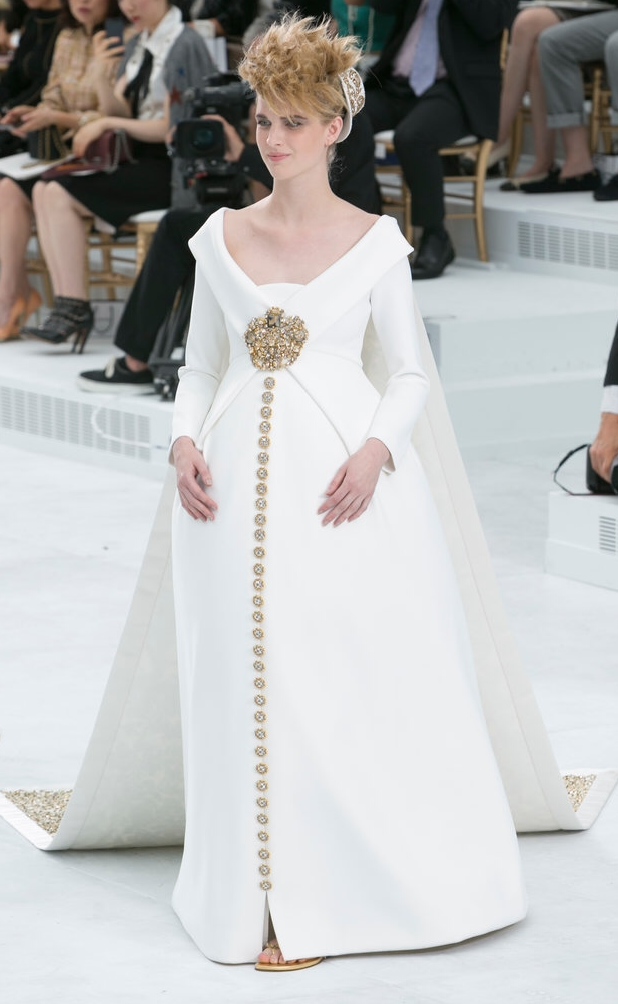 Chanel has a solution for mom's to be that are brides to be with this bustled creation. Note the peak of sandals..this girl is comfortable.