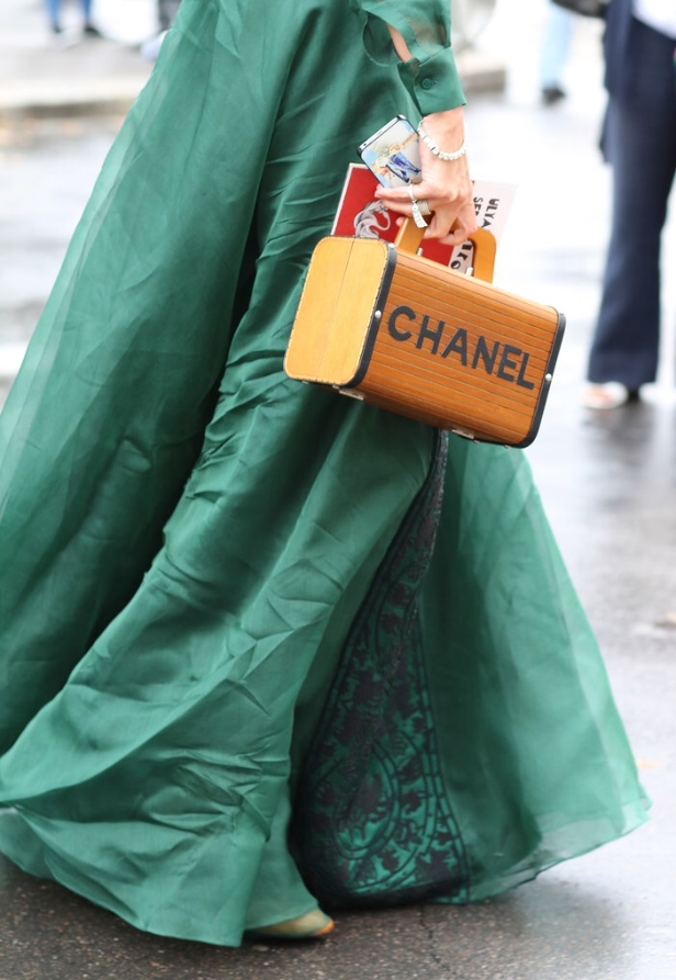 ..and here a faceless "complex" comrade wearing her Cinderella dreams in style...adorned in vintage Chanel and cell phone. Brava Cindy!