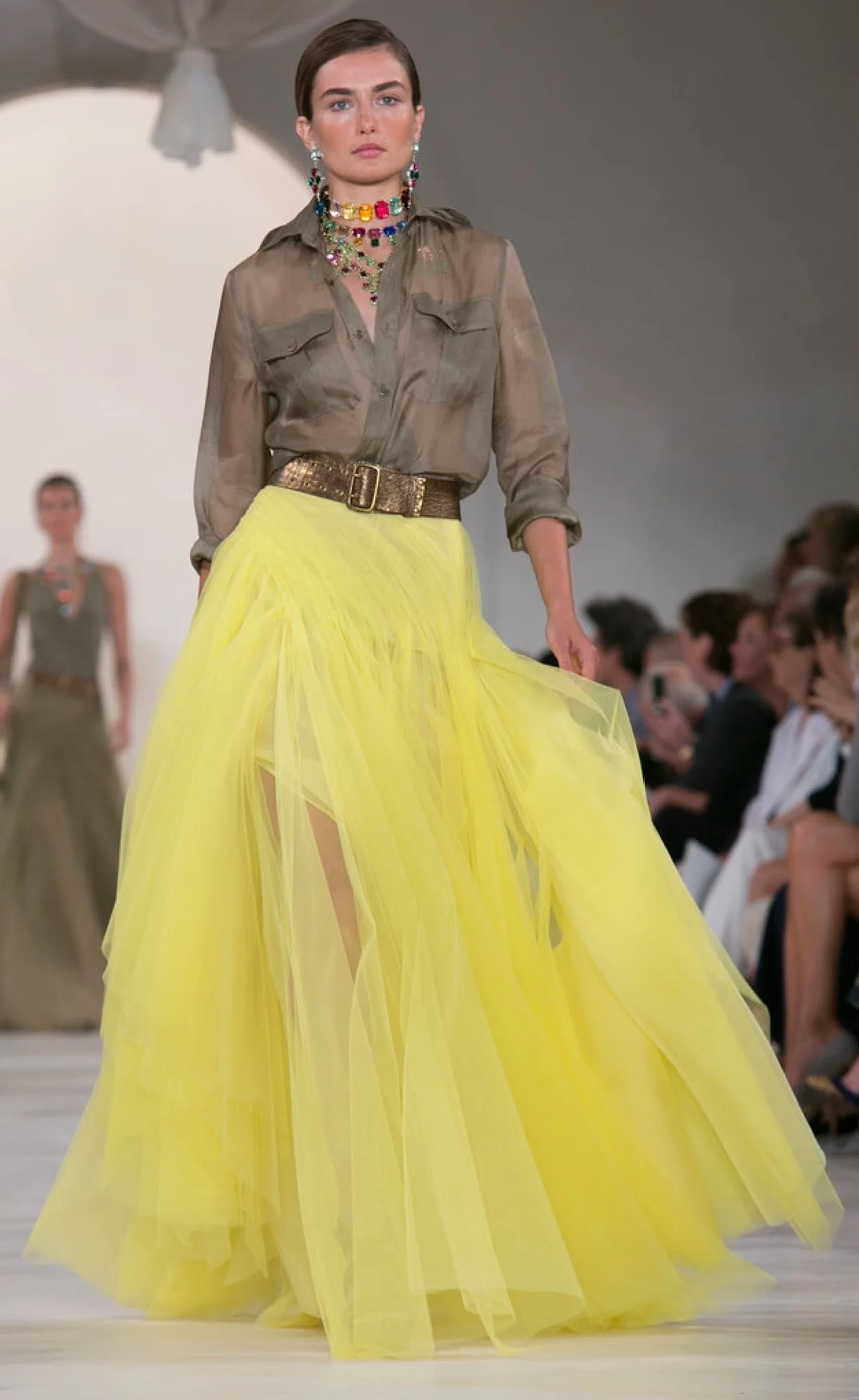 Ralph Lauren's safari tones are brightened with yellow tulle and a sheer iridescent button down shirt.
