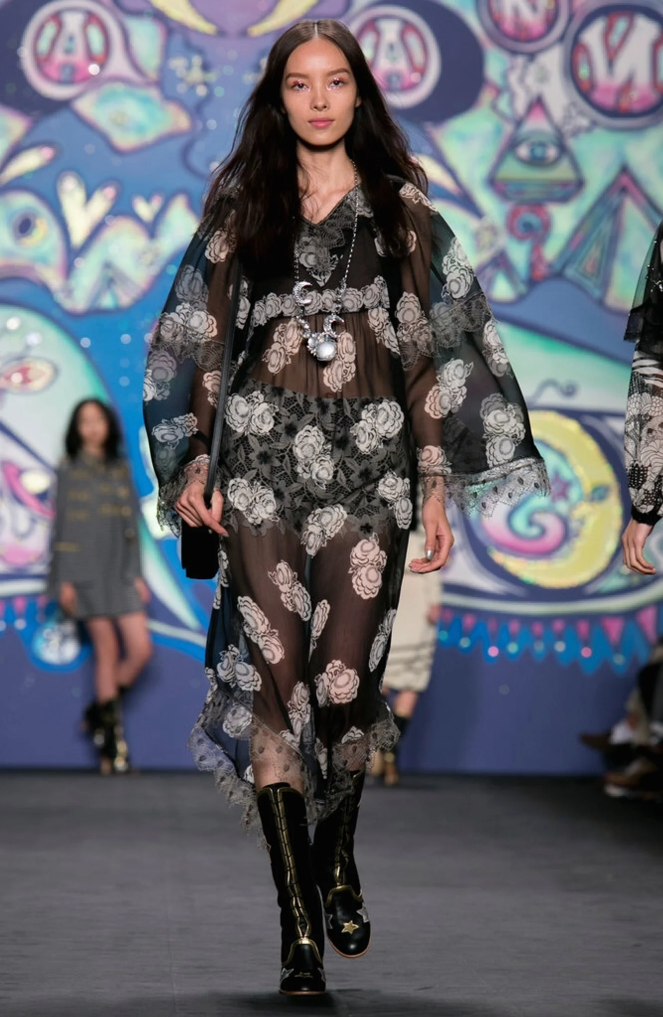 Anna Sui's approach allows the wearing of beautiful undergarments as part of the ensemble. The volume and length of the dress makes it feel innocent.