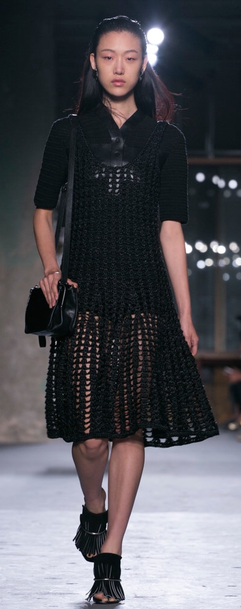 Proenza Schouler uses a heavy, wide-eyelet knit over a leather short jumper to communicate transparency.