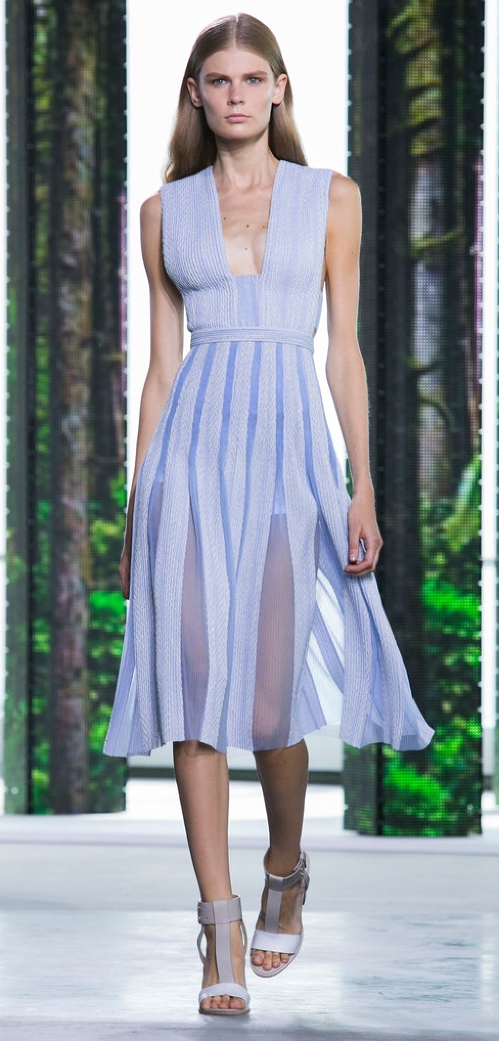 The pleated skirt of this fit and flare dress flutters out with sheer panels at the folds. (Hugo Boss)