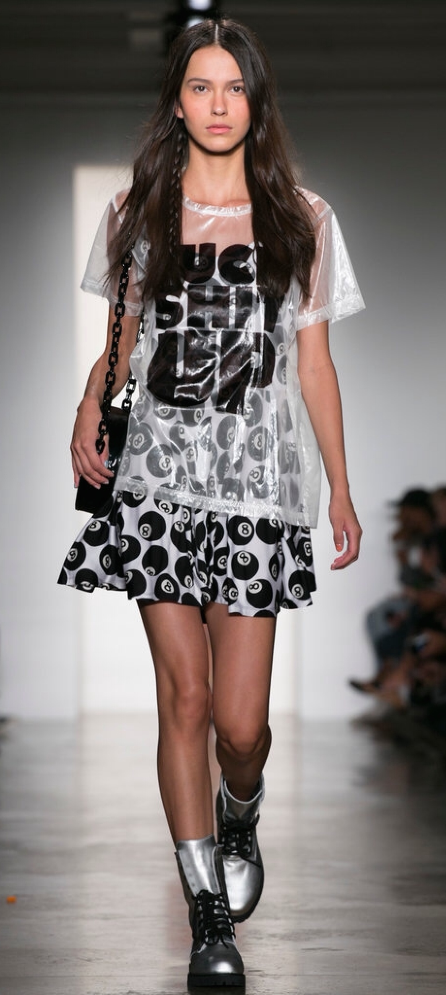 The shirt is completely transparent, but worn over a dress maintains its modesty...sans the message, of course. (Jeremy Scott)