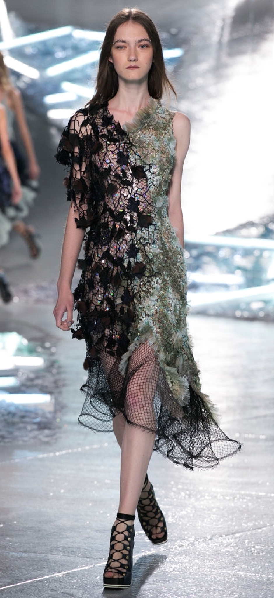 Rodarte's mixed media dress uses mesh, feathers and fringe...falling in all the right places of coverage.