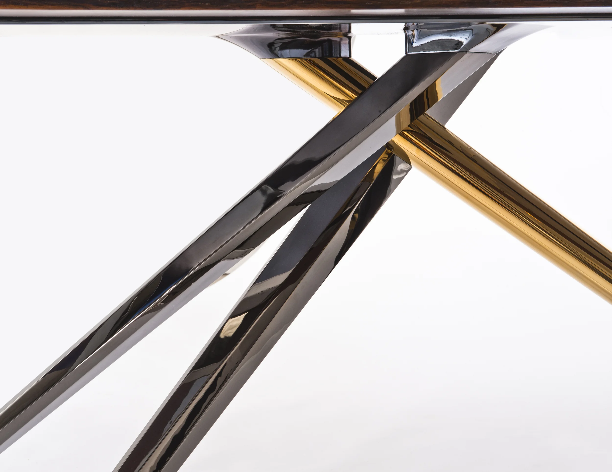 Aluminum bar stock legs, plated in dark chrome and 24k gold.