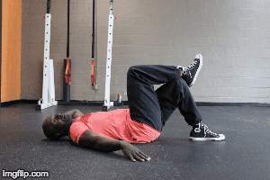On your back, cross your right leg over your left knee and crunch, bringing your right knees and left elbow toward each other. Do 15 on each side!