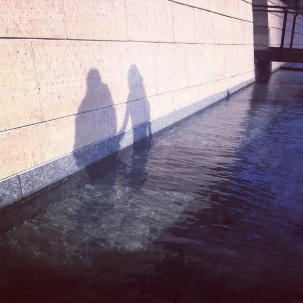IMG_3132. gardens, reflection, and shadow- 2 figures.jpg