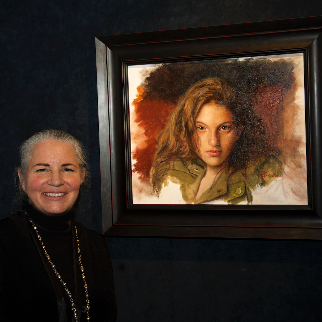 Robin Damore next to her painting.