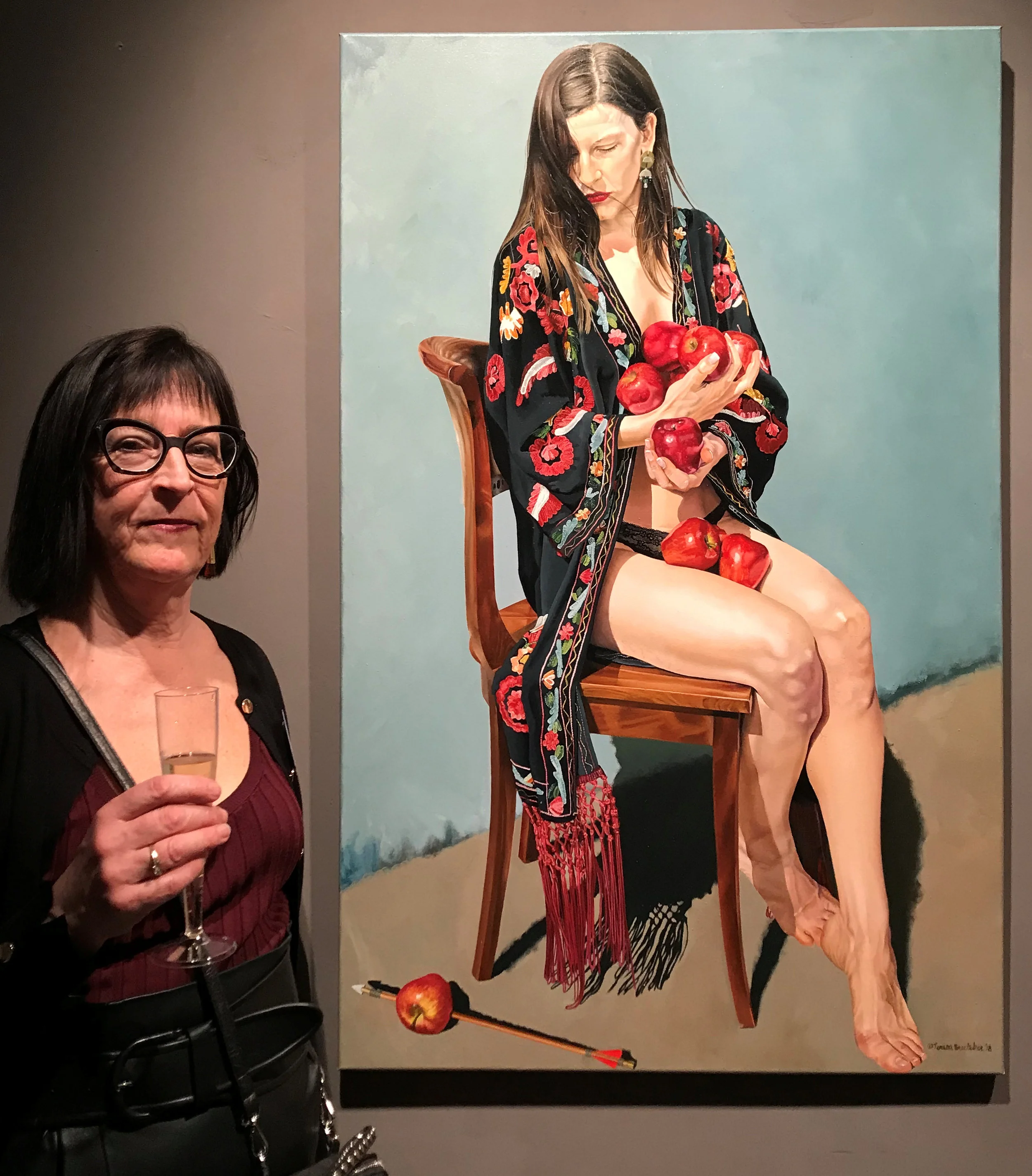 Teresa Brutcher next to her painting entitled William won’t tell