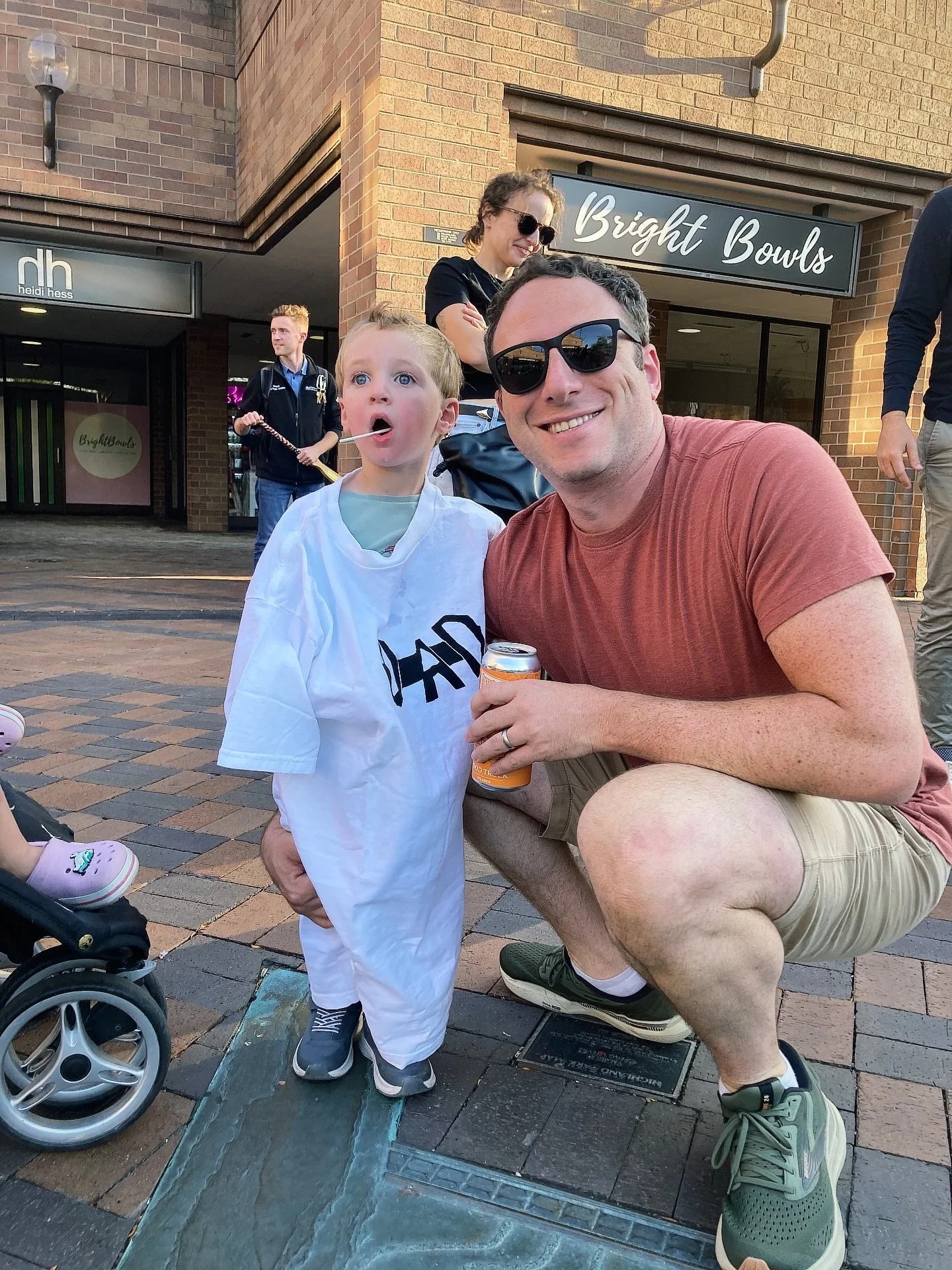 Hey guys I&rsquo;d like you to meet Mike and his son. Mike was nice enough to come up and sing with me at my show in Highland Park on Friday. As a result he was rewarded with one of my &ldquo;Rad Dad&rdquo; t-shirts that his son put on to protect him