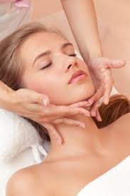 Massaging in light upward motions like this to prevent sagging.