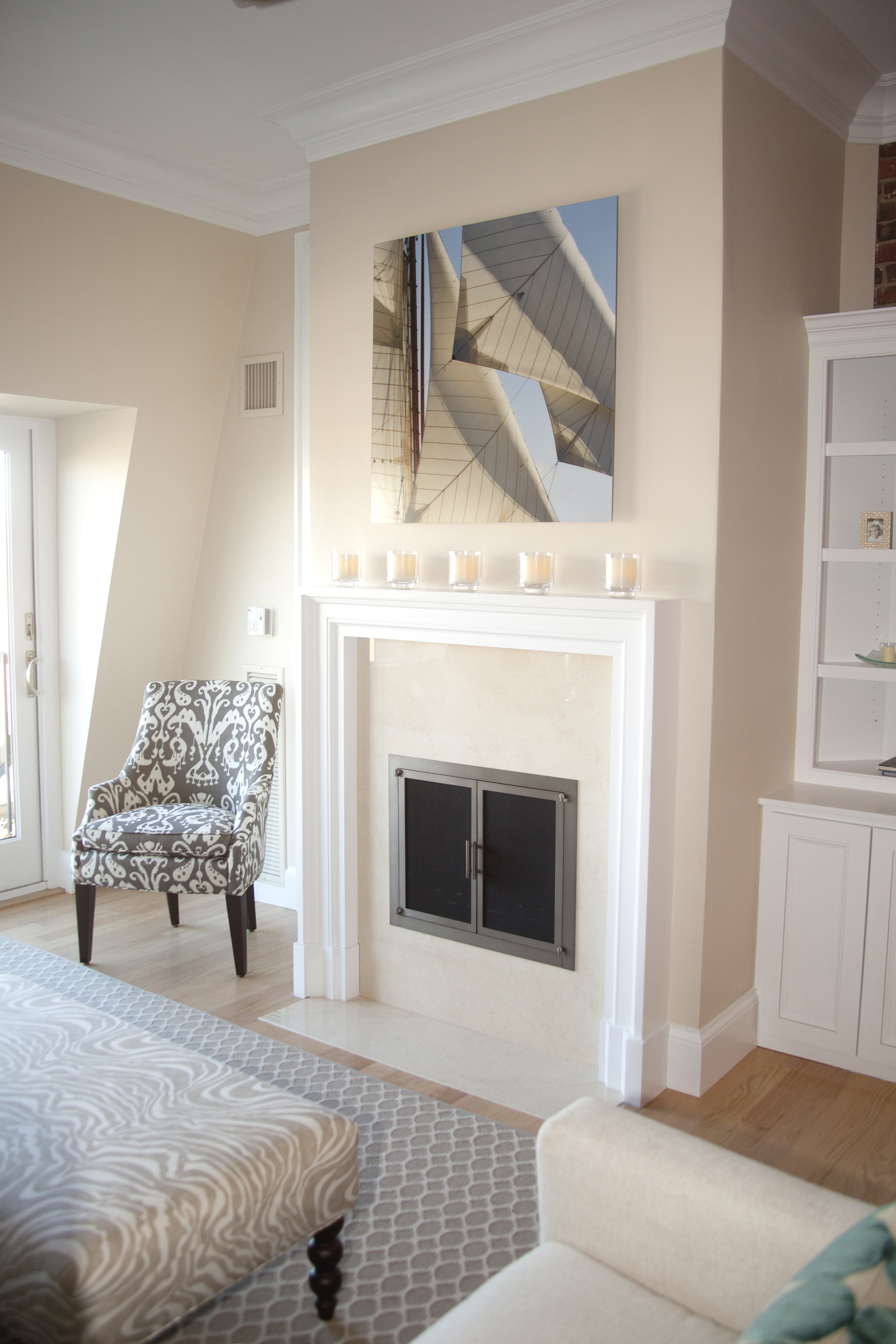 Also consider objects on the mantel when determining how high to install artwork.