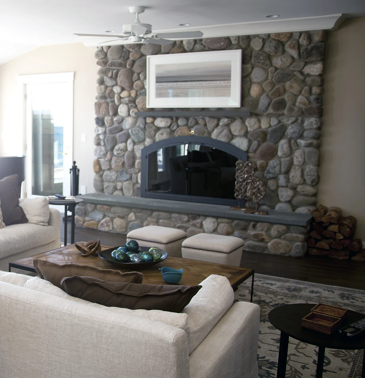 Choose artwork and framing to enhance and complement the surrounding surface. In this example, the neutral soft colors in the photograph are a match to the colors in the stonework.