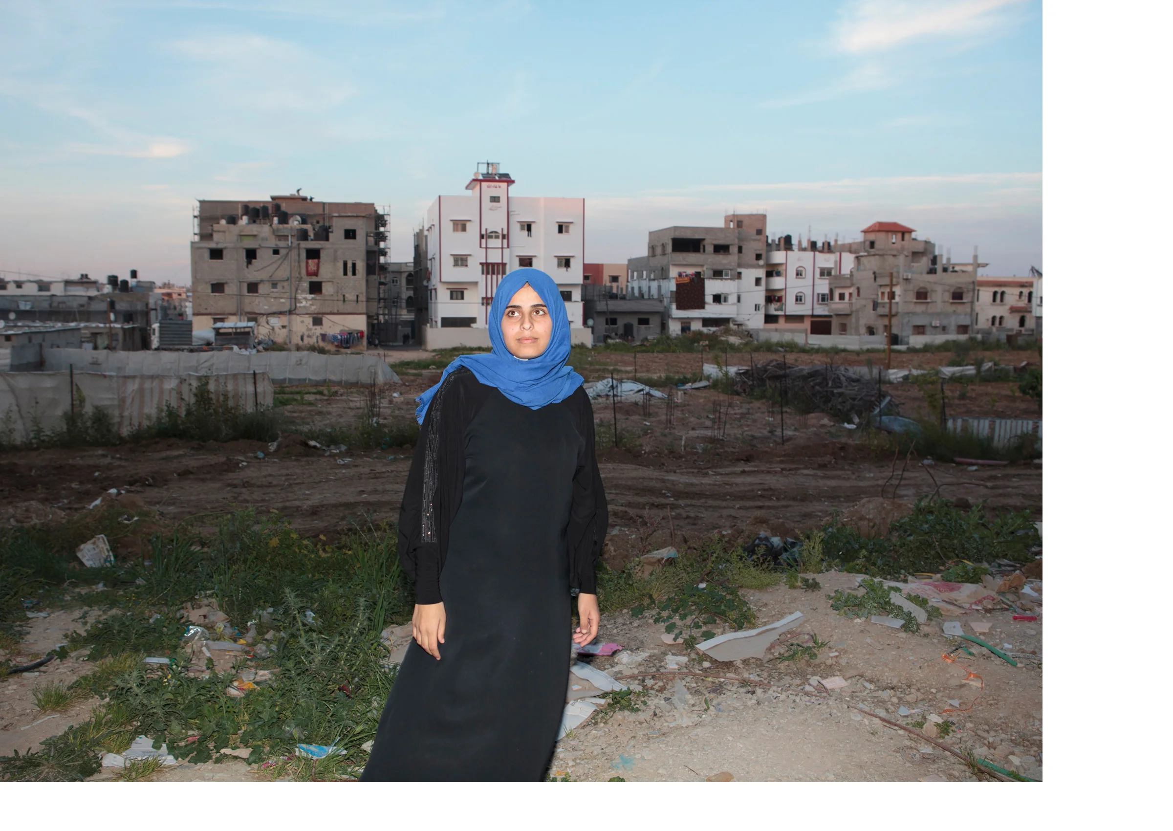 Shuja'iyya, Gaza Eslam Shamali stands amid the rubble of her destroyed home. Eslam’s brother was a Hamas commander who died fighting in this neighborhood during the 2014 War. Her mother, father, and another brother were killed in the family's home, which was destroyed during the same battle. "For me as an adult, it's not a big deal for me to hear the sound of the drones, if it is in the night or the day, I got used to that and I know that it's not something healthy for my psychological situation, but that's the reality."