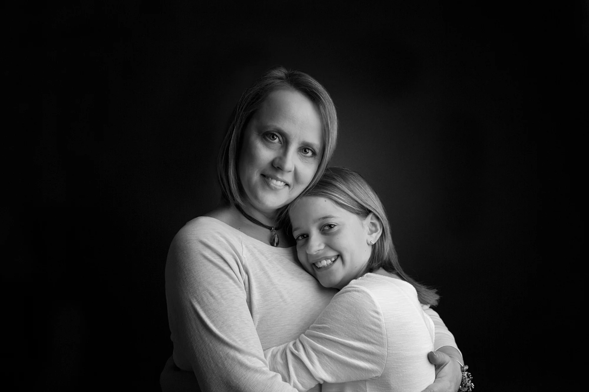 Mother and daughter hugging portrait Walter Sheehey Photography Watertown, New York