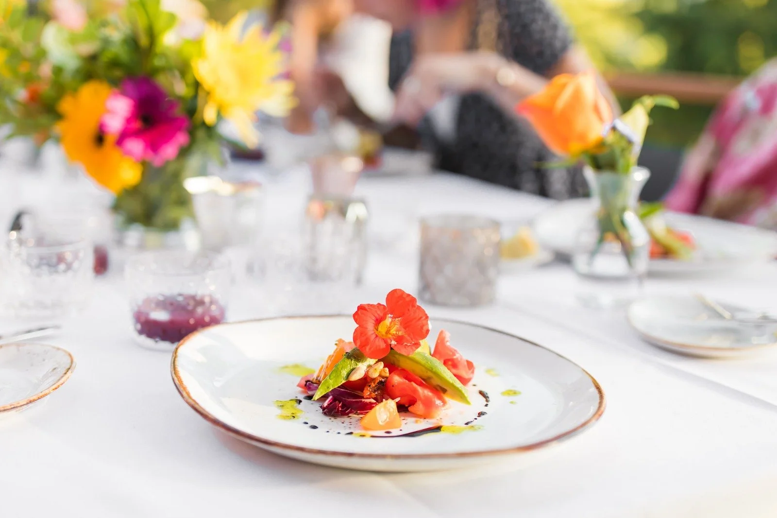 An elegant and majestic premium plated dish, perfectly prepared in keeping with the highest gastronomic standards, and garnished with a beautiful edible red flower.