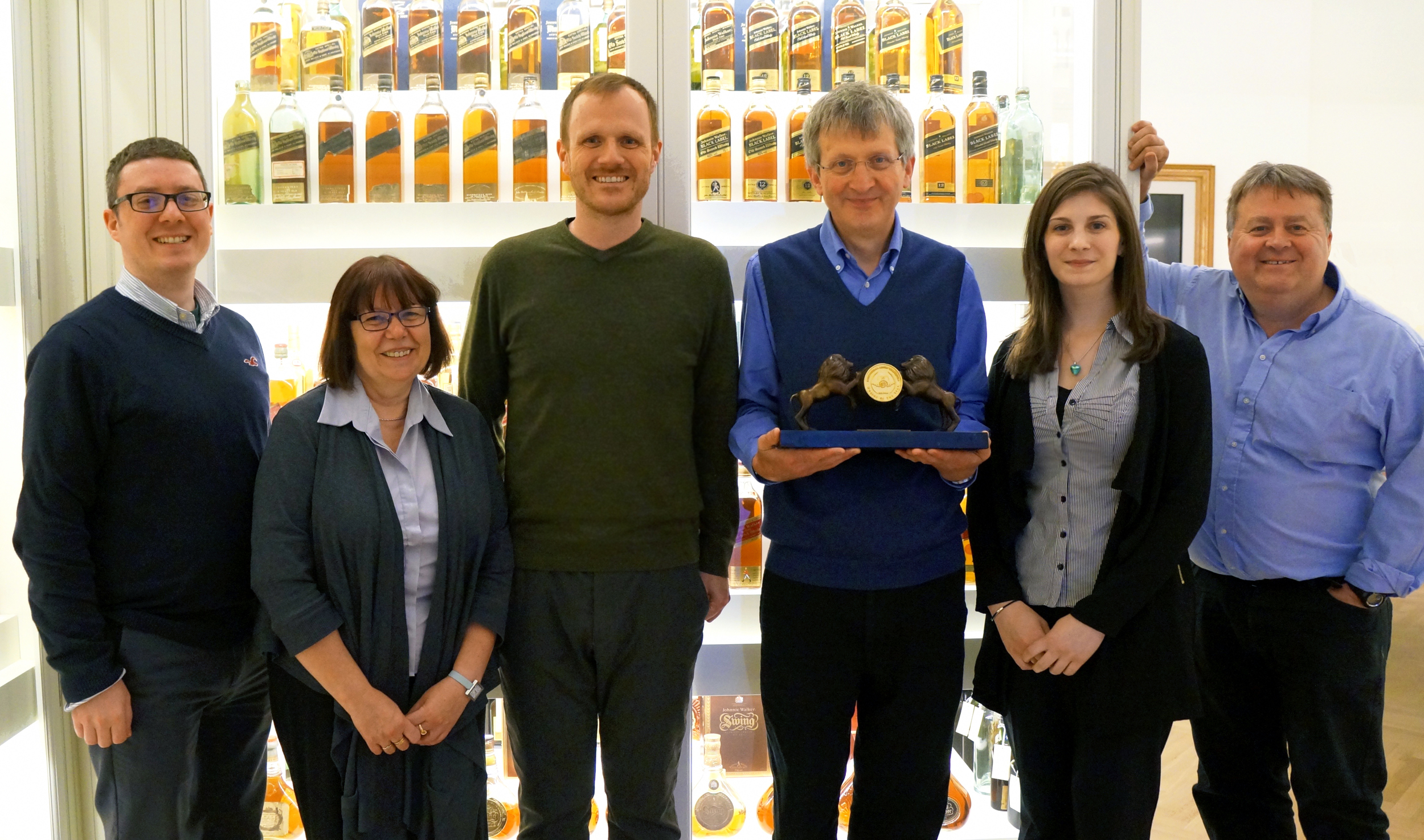 Jim Beveridge, Master Blender at Diageo, and his team receiving the Golden Barrel Trophy during a special award ceremony held at Diageo Archive.