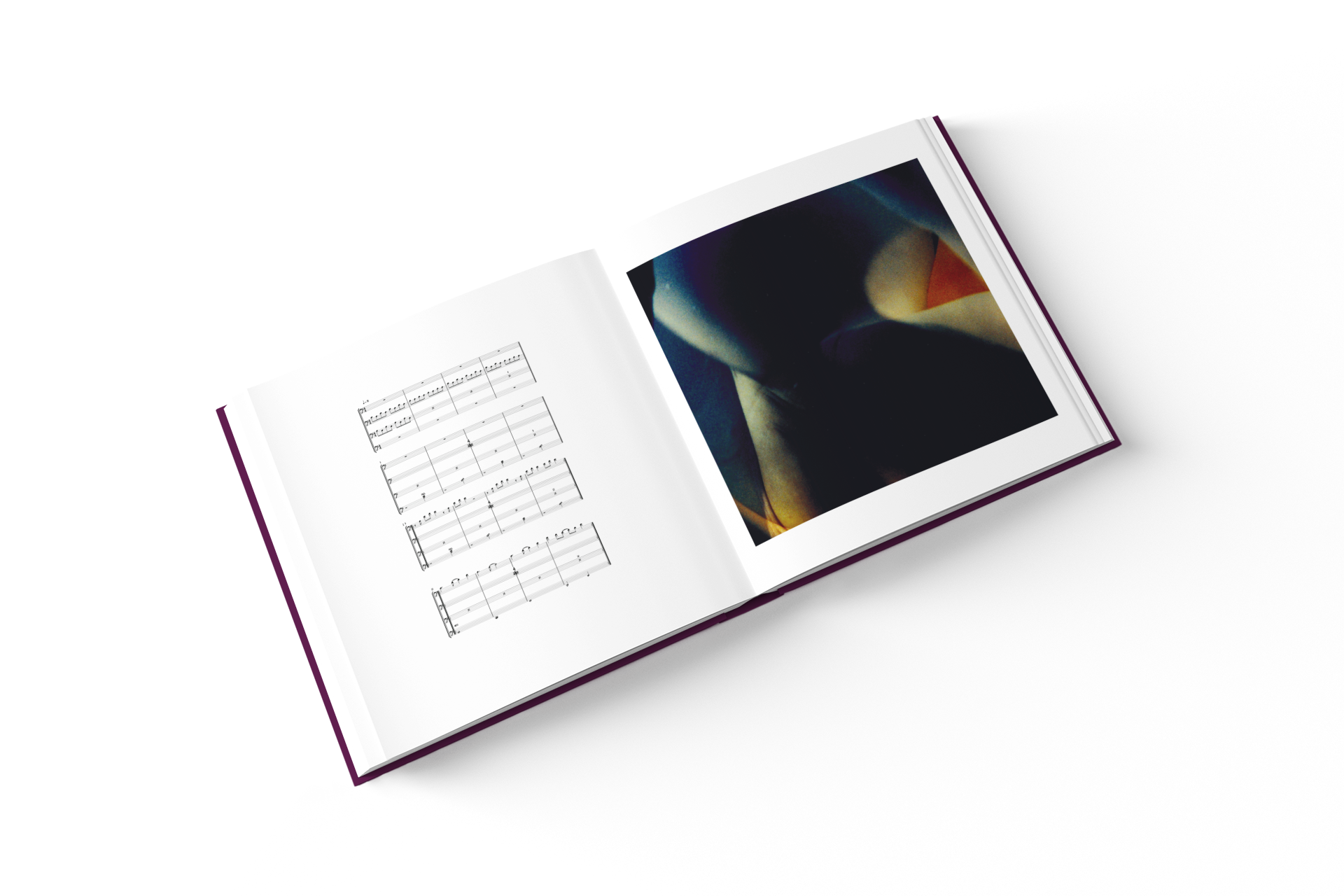 mockup-of-a-square-hardcover-book-lying-open-on-a-solid-color-surface-1548-el-4.png