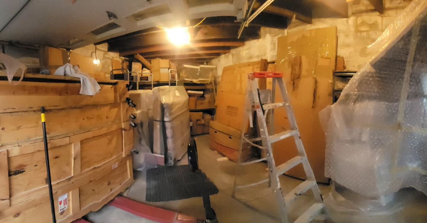 That's a glimpse of the garage where I moved all my paintings and another of my now much emptier studio and a self-portrait I didn't remember making back in my 20s or 30s that fell out of a pile of work deep in storage.