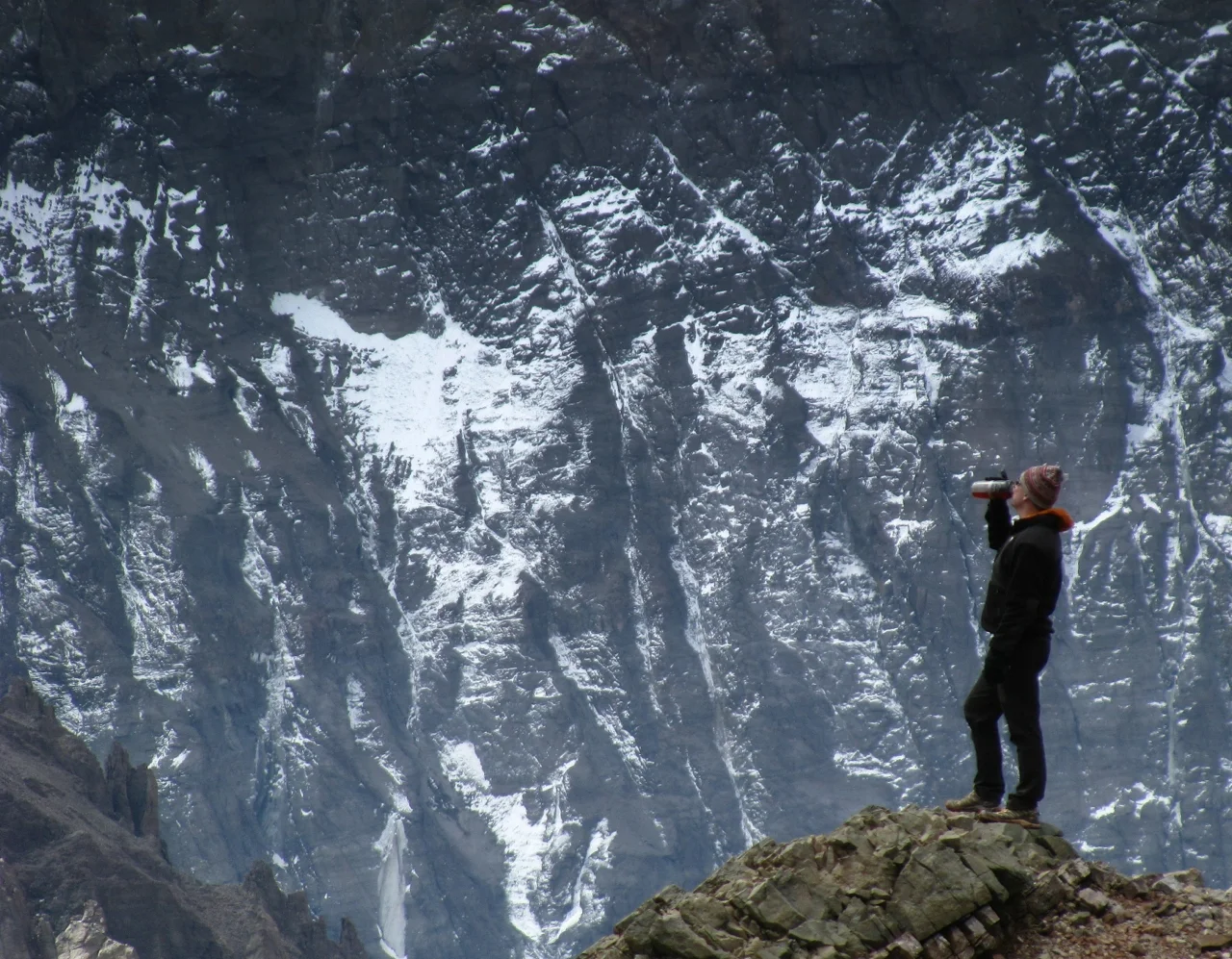 John taking a break near Plaza Francia. Ahead, rising from 11 to 22,000 feet, is the massive south face of Cerro Aconcagua. 