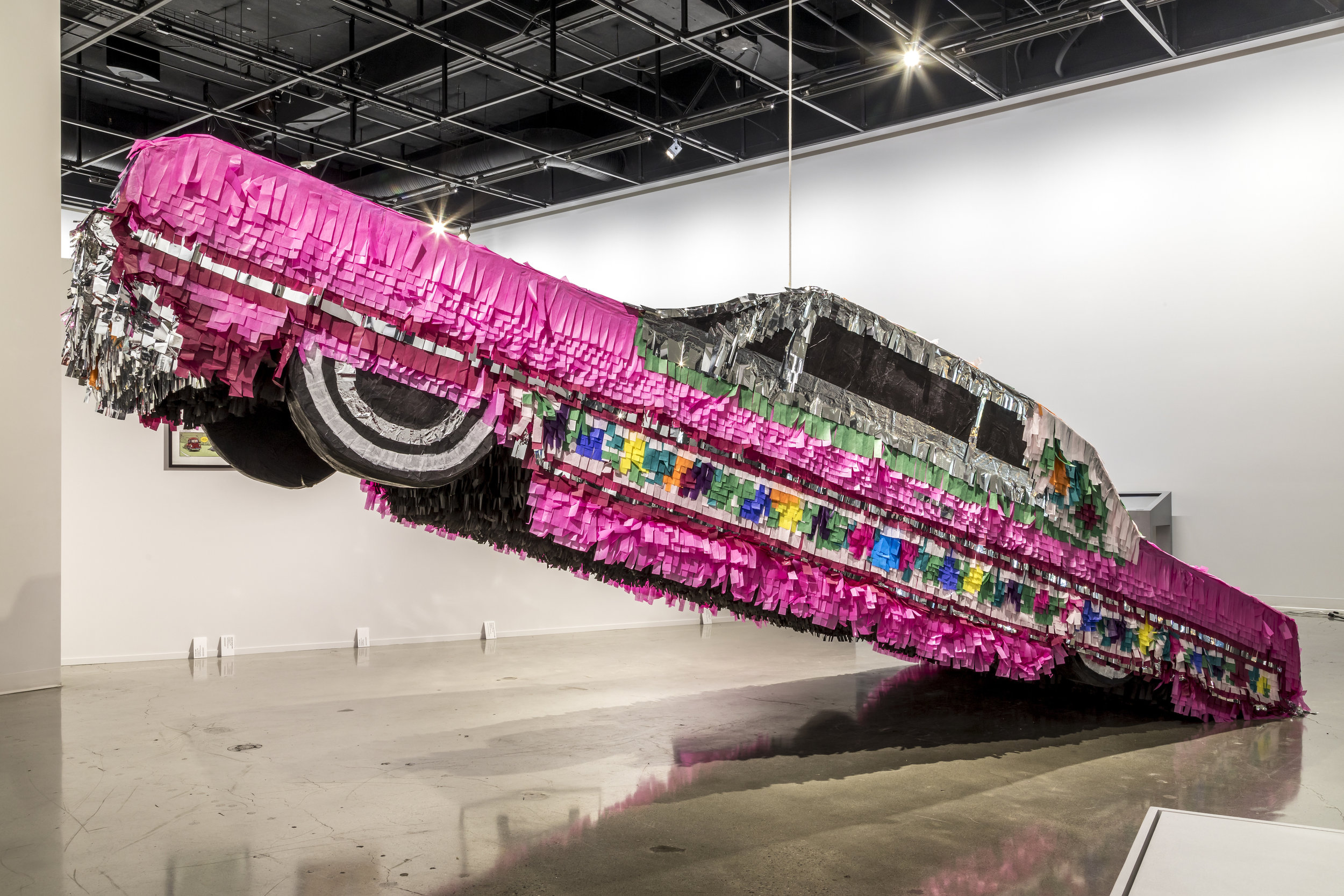 Gypsy Rose Piñata. 2017. Found objects, cardboard, styrofoam, paper and glue. 5'x19.5'x6.5' Photo: Courtesy Petersen Automotive Museum