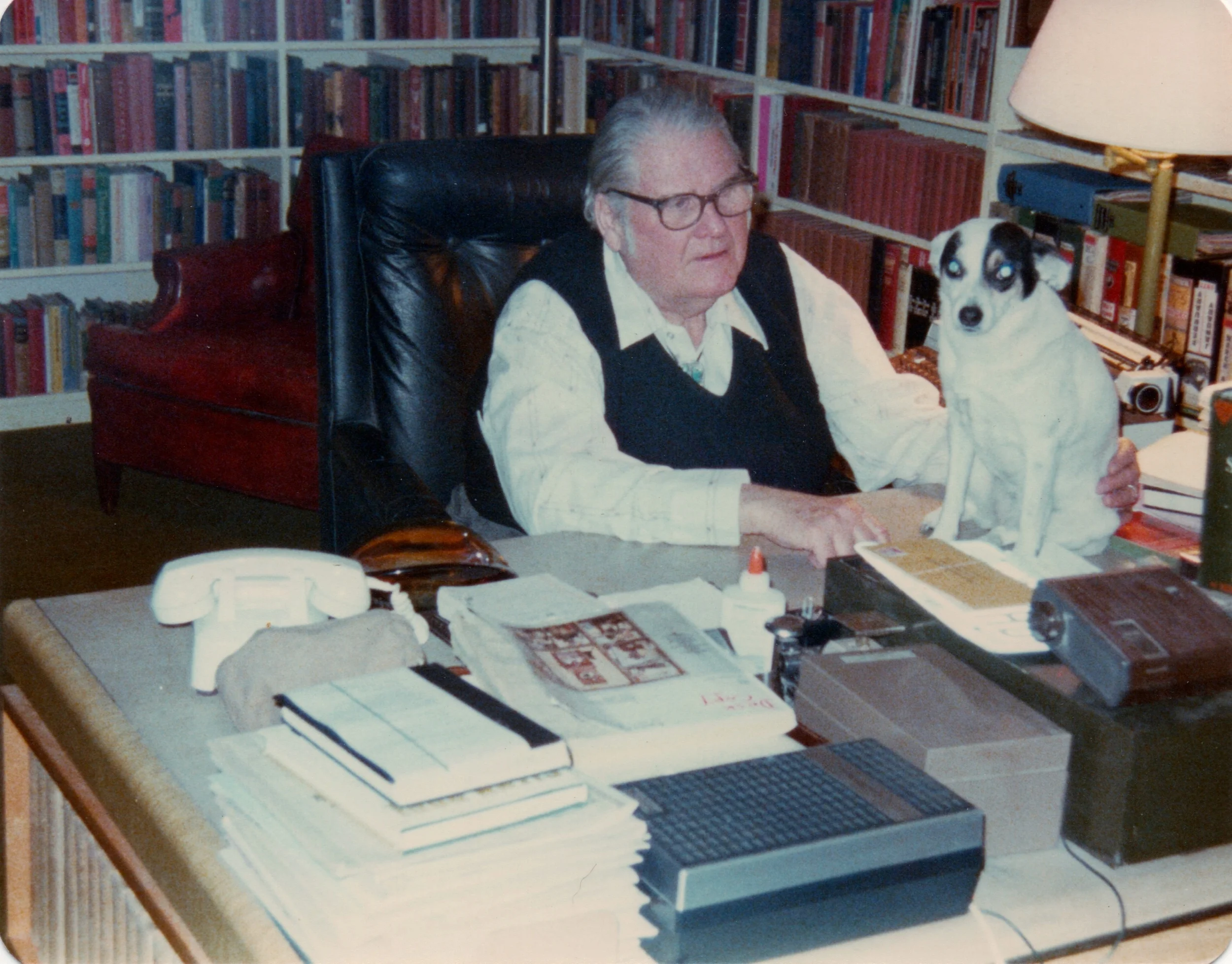 John and a small part of his library in his Santa Fe home in 1979. Photo by the late Charles E. Henry, BSI.