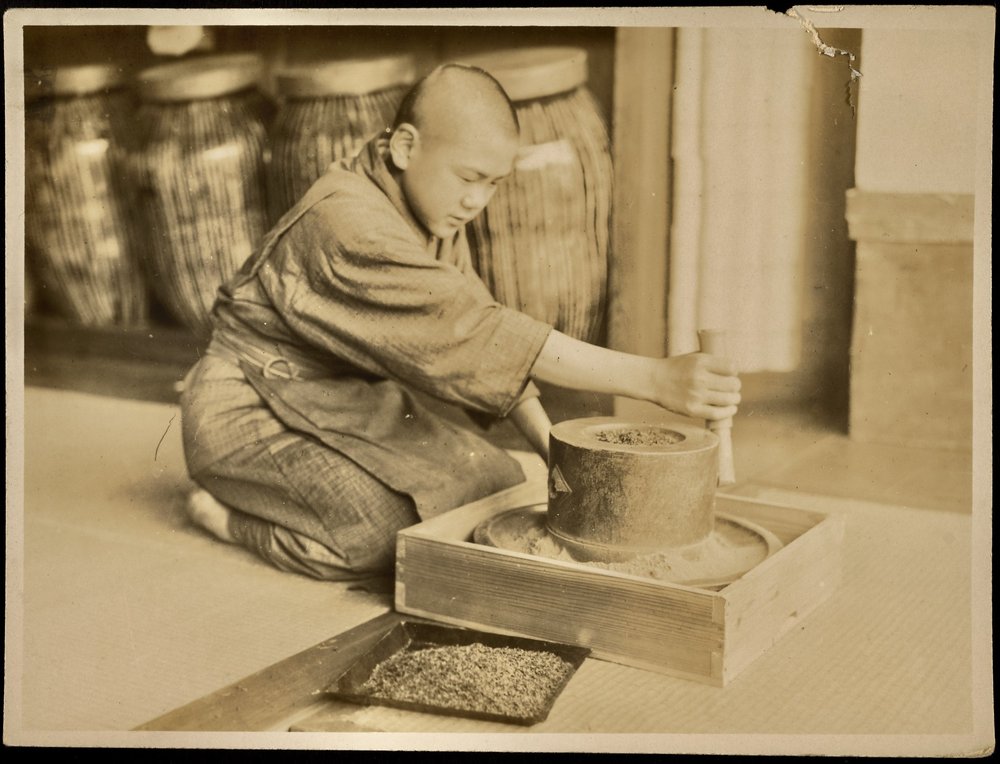 Grinding the tea leaves.