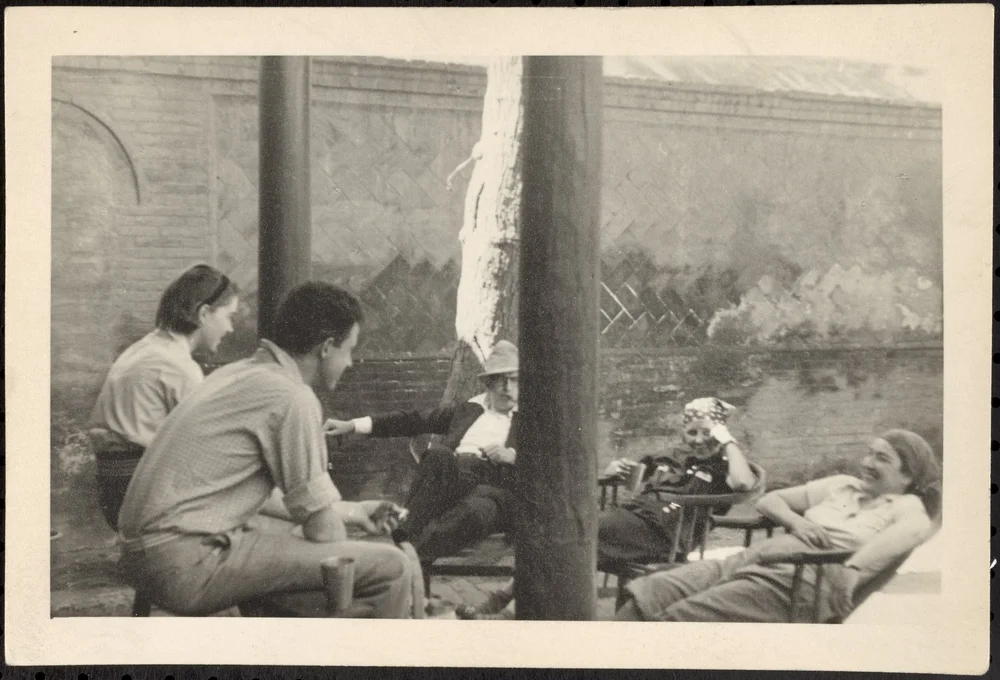 Not sure who else is here, but that's Starrett puffing his cigar behind the pole.