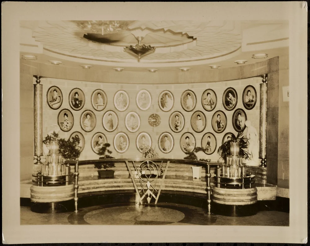 A house of prostitution. The females in those photos must be the employees. 