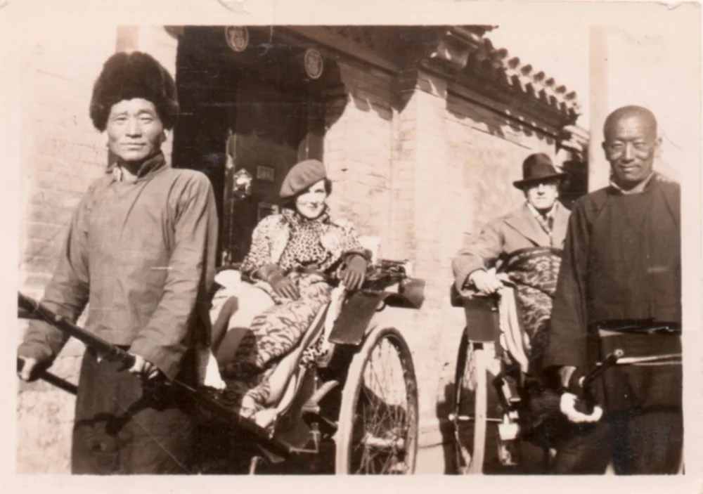With Ray in front of their rented home in Peking.
