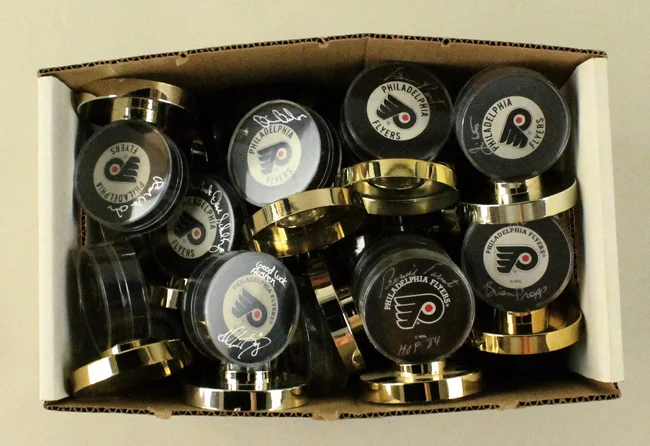 Signed Flyers' Pucks