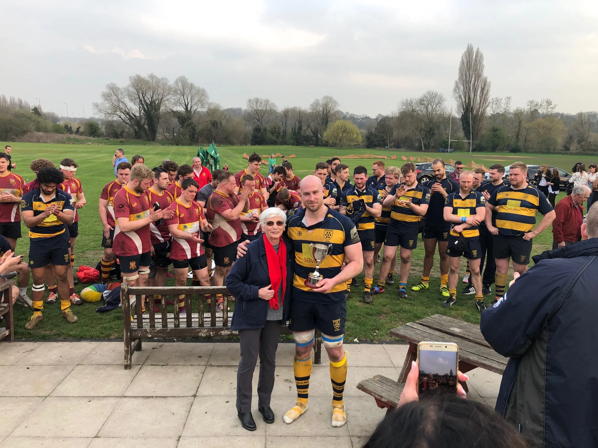 Oaks captain Stuart Coleman receives the Ron Standen Cup from Pat Standen. Photo Credit: Steve Fitzmaurice