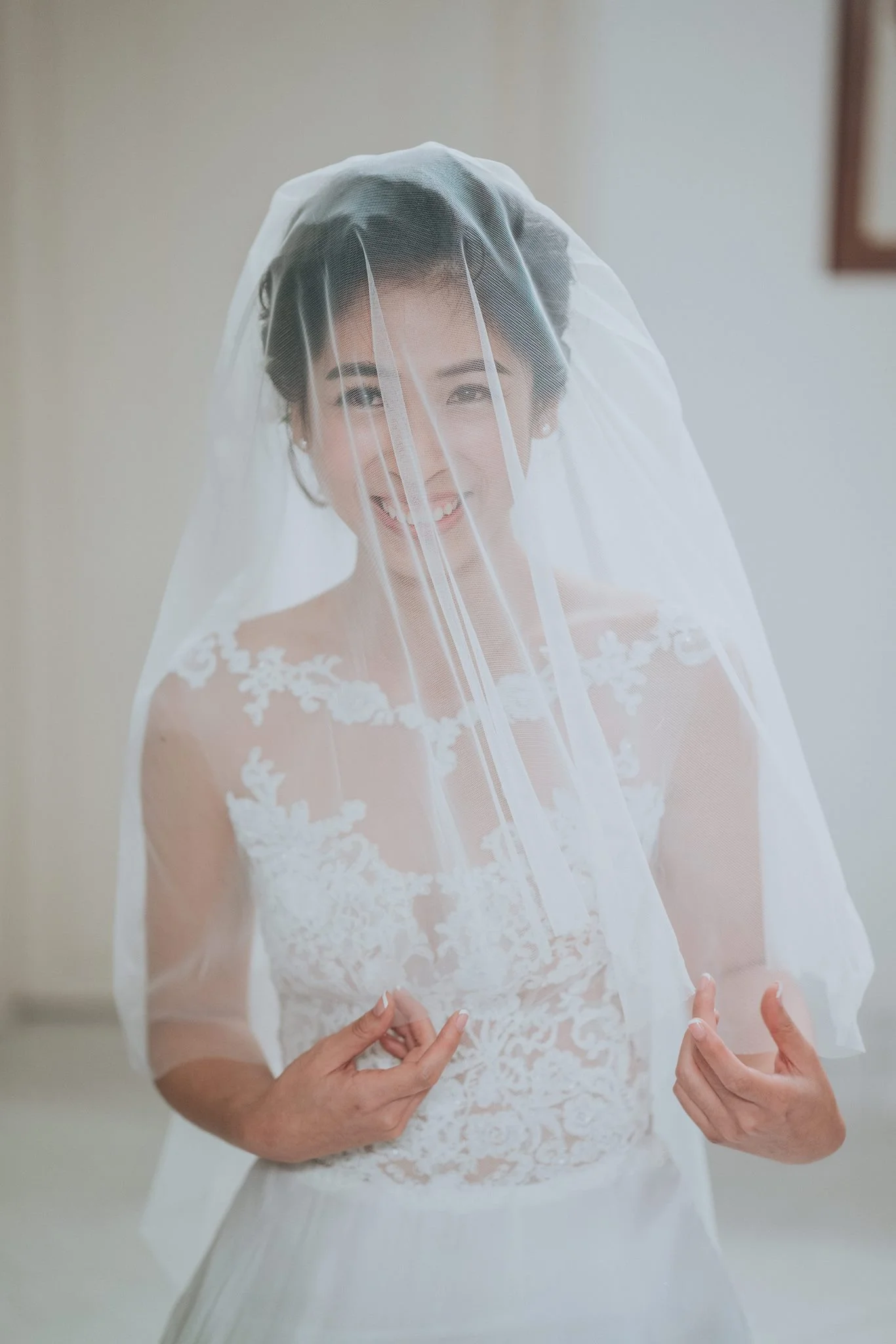 Joan looking ethereal in one of our off-the-rack illusion lace top gown. Photo by Multifolds Photography.