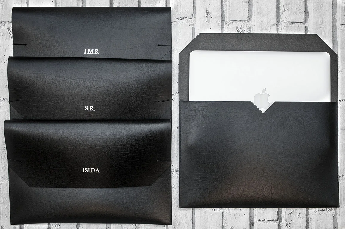laptop sleeves shown open and closed with a mac inside, featuring silver foil embossed custom names