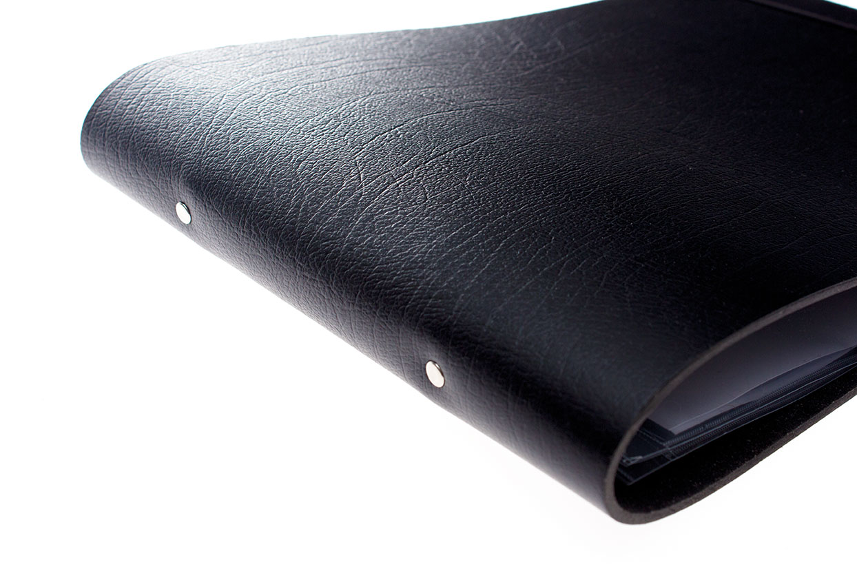 side view of a black leather-bound portfolio album