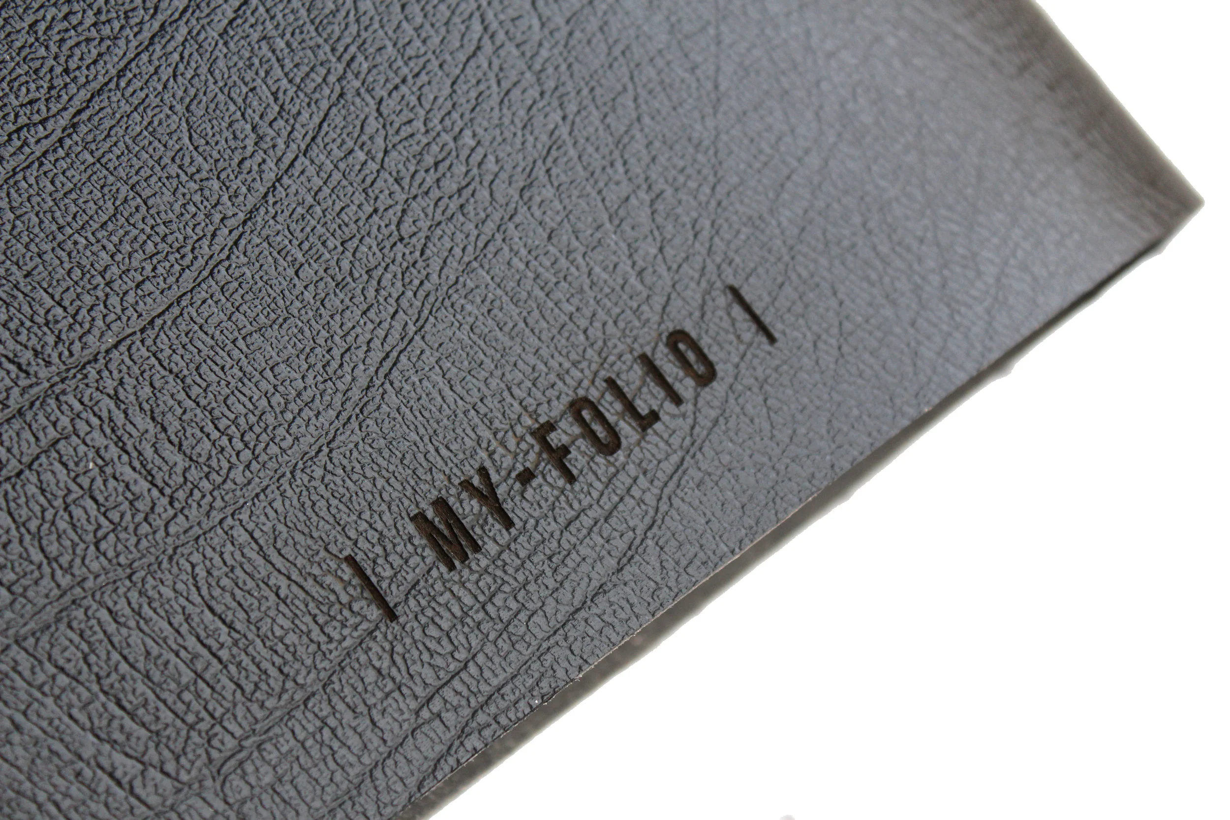 logo engraving of the back cover of a black leather portfolio
