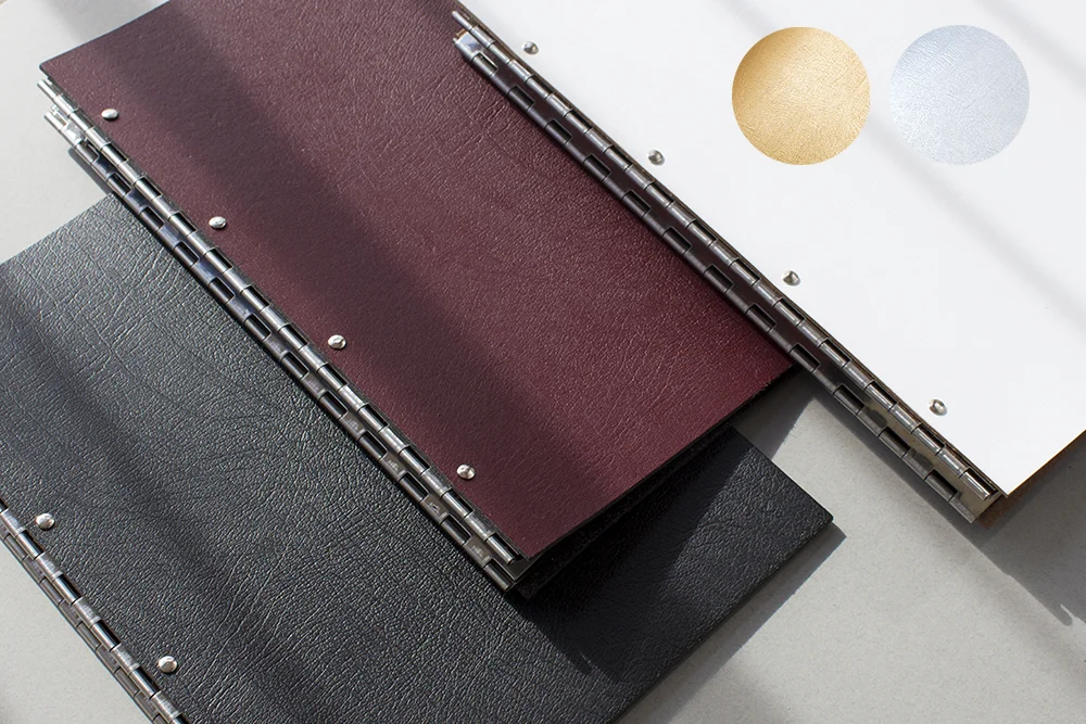 Leather display portfolios in A4 portrait in red, white and black leather