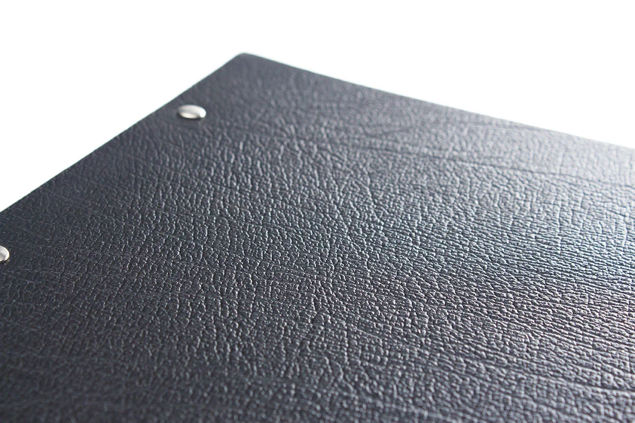 Close up of the texture of our black leather used to make our personalised portfolios