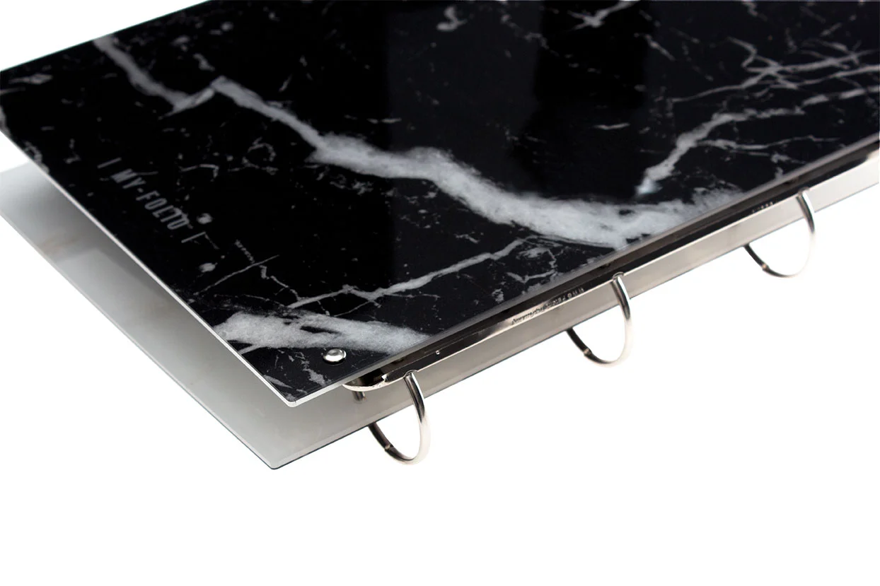 View of the back of a marble effect portfolio folder book with name engraving in black marble