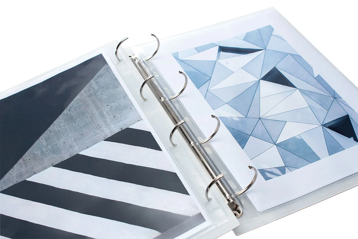 Graphic design portfolio in A4 portrait in a white grey effect marble portfolio made from acrylic perspex
