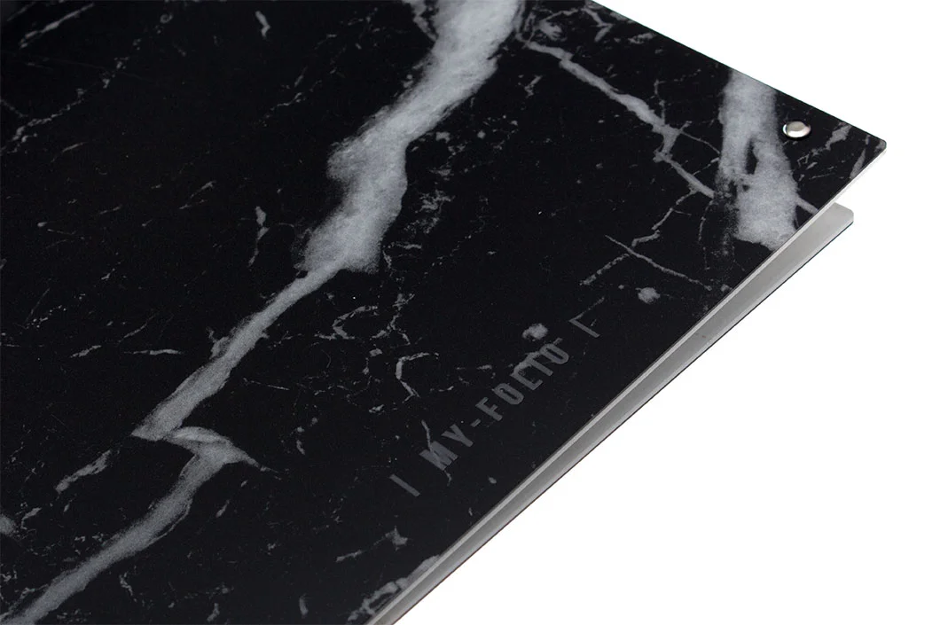 engraved logo on the back cover of an A4 and A3 portfolio in black marble effect made of acrylic perspex