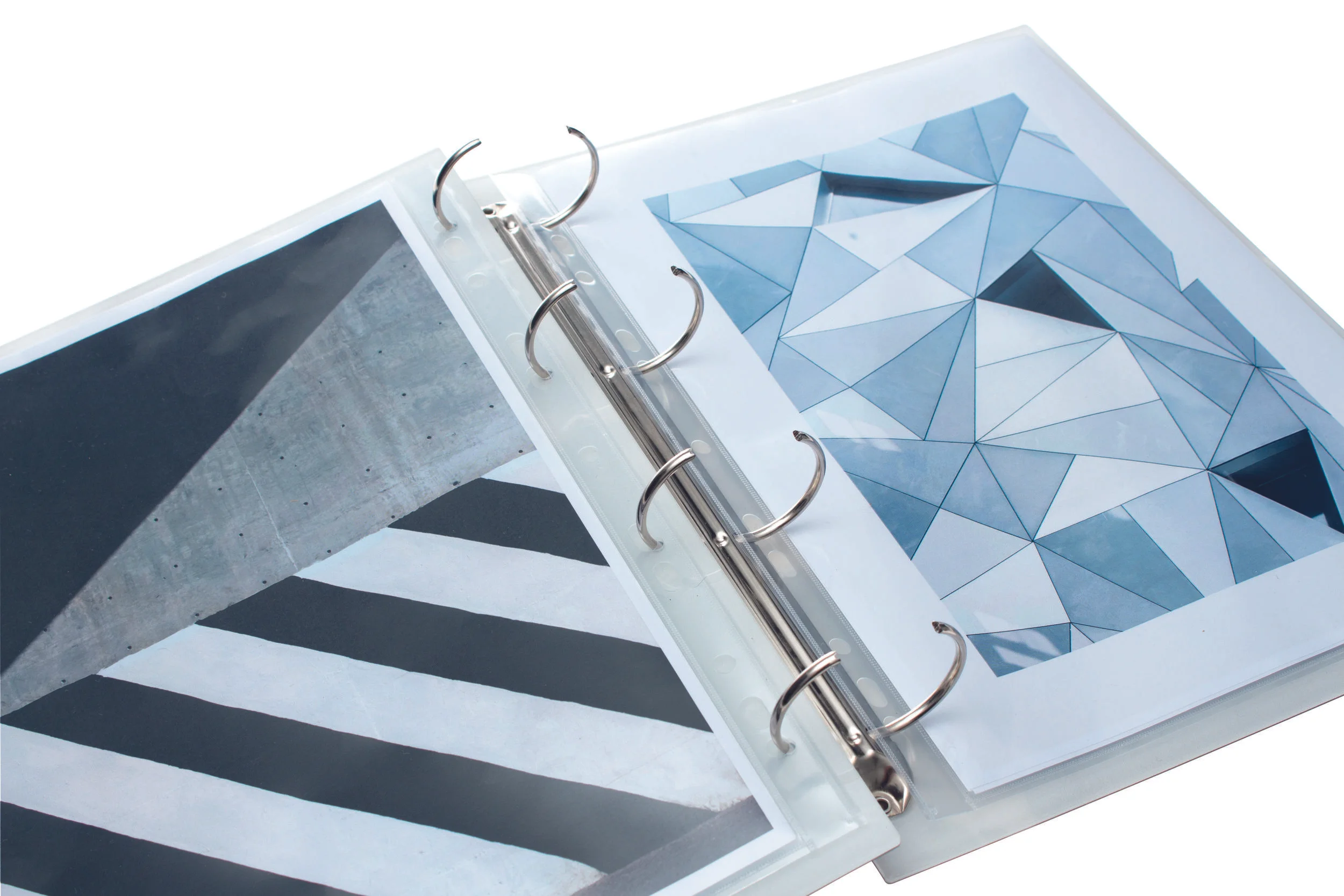 Graphic design work inside a white marble portfolio folder