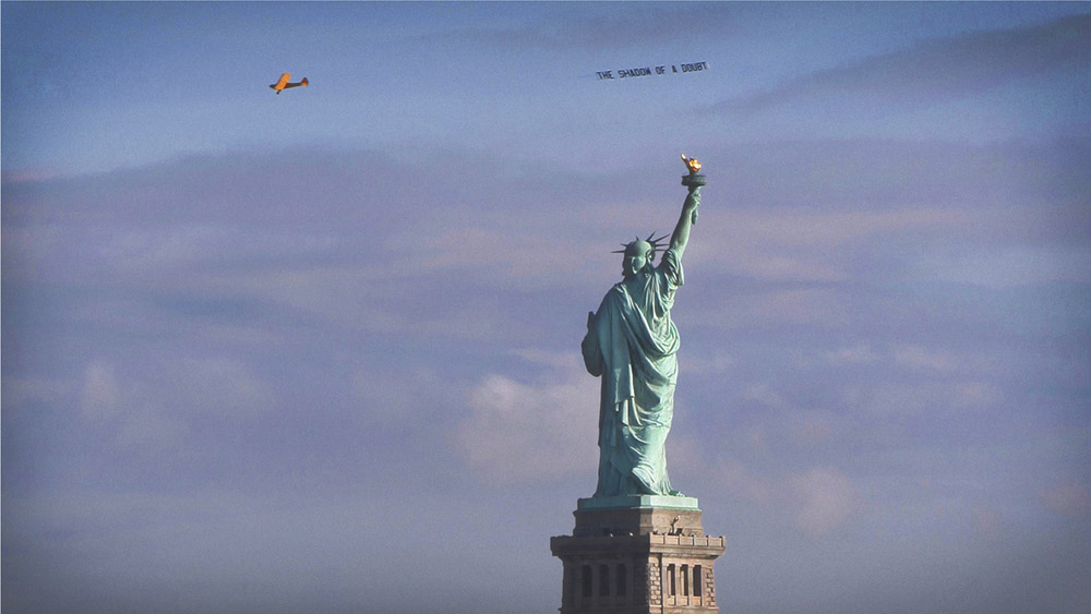 Aircraft banner circling the Statue of Liberty's torch, Veterans Day, 2014
